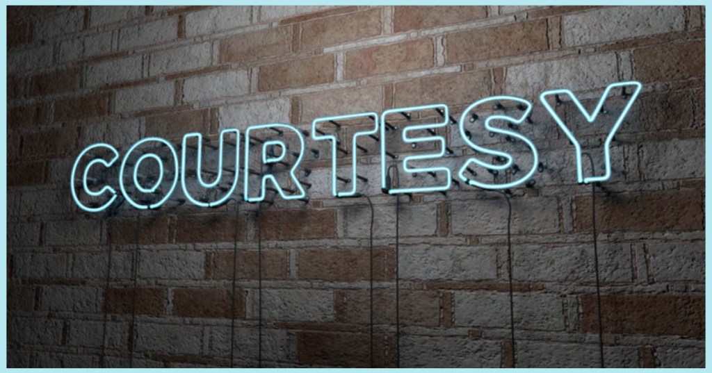 Neon sign of the word "Courtesy"